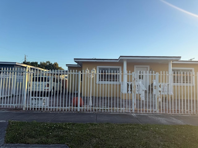 view of gate featuring a carport