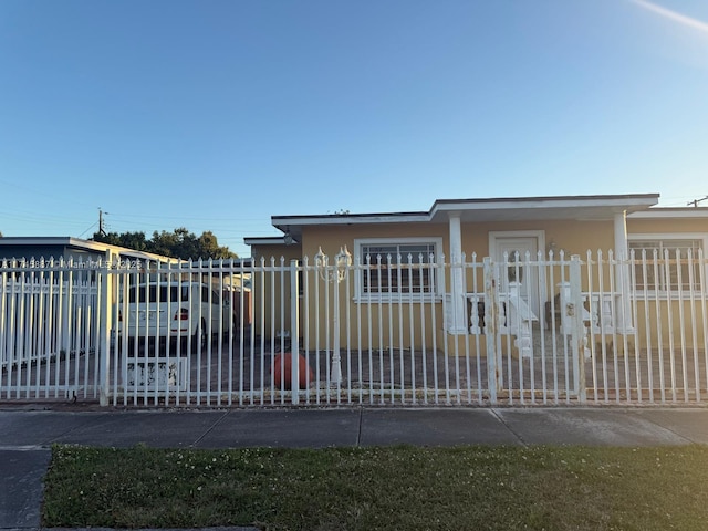 view of gate featuring a carport