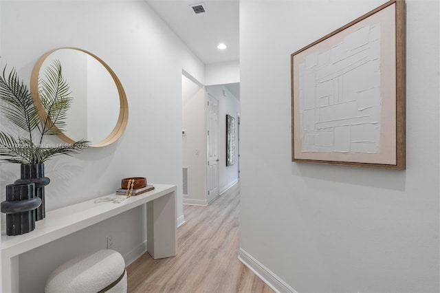 11539 SW Visconti Way, Port St Lucie, FL 34986 - hallway featuring light wood-style flooring, baseboards, and recessed lighting