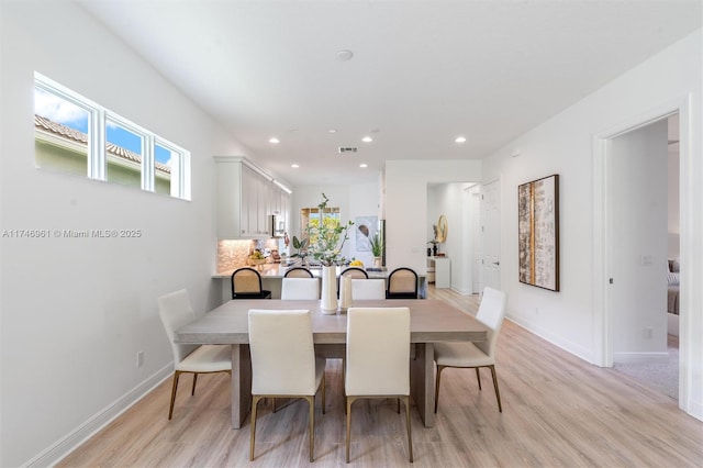 11539 SW Visconti Way, Port St Lucie, FL 34986 - dining room featuring light wood-style floors, recessed lighting, and baseboards