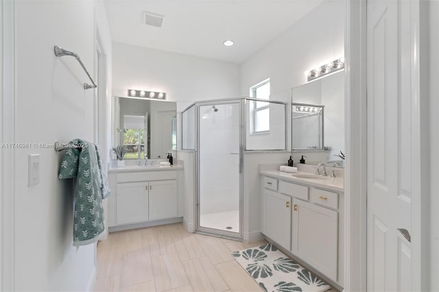 11539 SW Visconti Way, Port St Lucie, FL 34986 - bathroom featuring a stall shower and two vanities