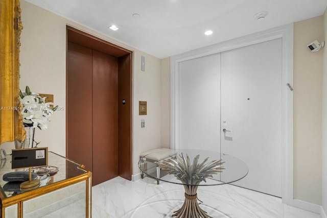 interior space featuring elevator and recessed lighting