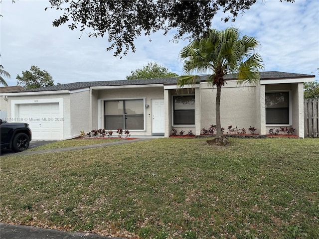 view of front facade with a front lawn and a garage