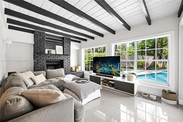 living room featuring light tile patterned floors, wood ceiling, a fireplace, and beamed ceiling