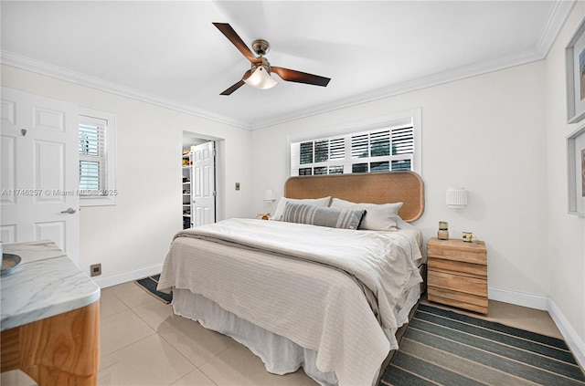 bedroom with ornamental molding, tile patterned floors, and baseboards