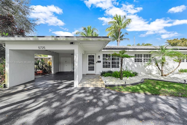 ranch-style home with stucco siding