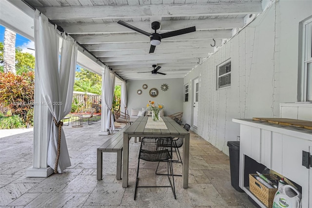 view of patio / terrace featuring outdoor dining area and a ceiling fan