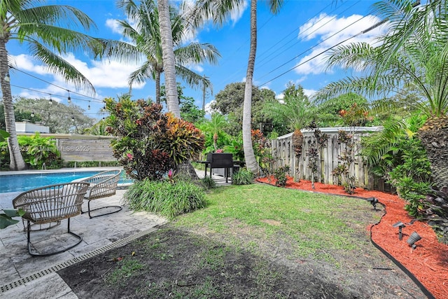 view of yard with a fenced backyard and a fenced in pool