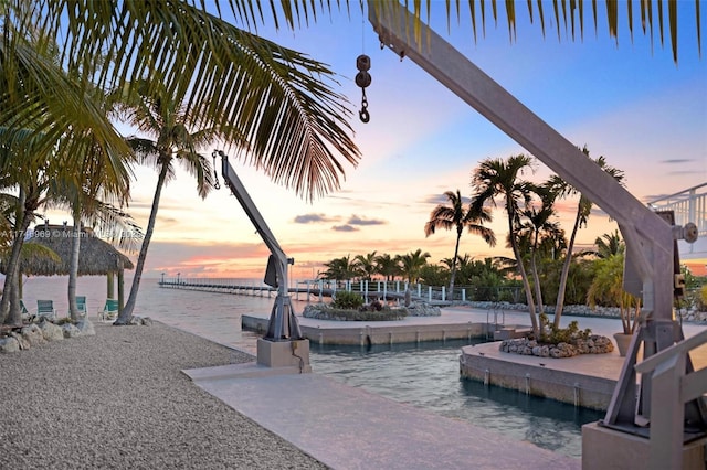 community pool with a water view and a patio