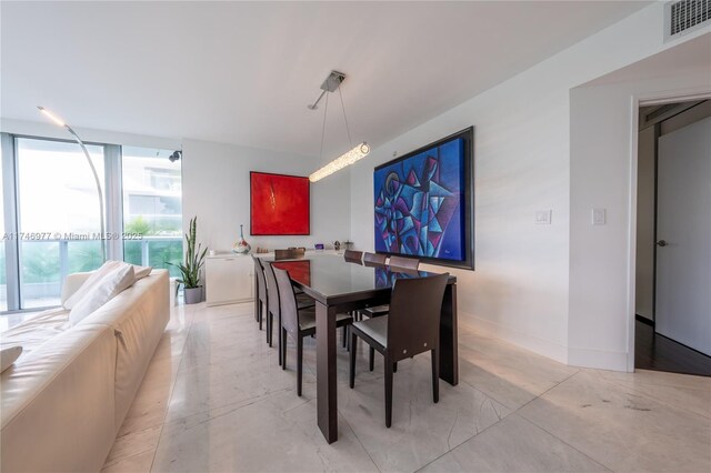 dining room featuring expansive windows