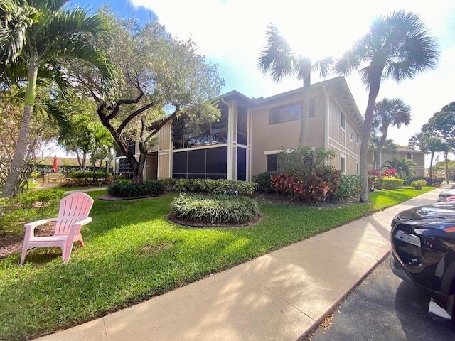 exterior space featuring a lawn and stucco siding