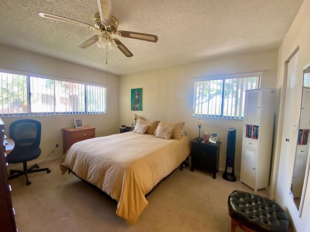 7128 Ashmont Cir Unit 207, Tamarac, FL 33321 - carpeted bedroom featuring a textured ceiling, ceiling fan, and a closet