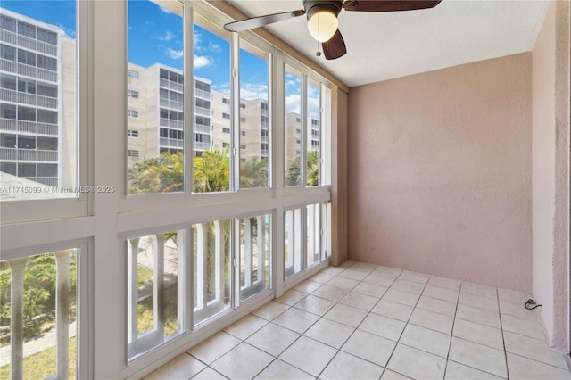 301 NE 14th Ave Unit 201, Hallandale Beach, FL 33009 - unfurnished sunroom with a textured wall and tile patterned floors