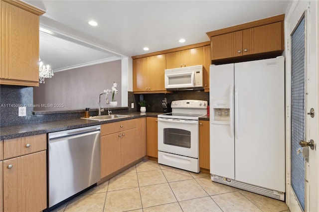 301 NE 14th Ave Unit 201, Hallandale Beach, FL 33009 - kitchen with white appliances, a sink, backsplash, dark countertops, and crown molding