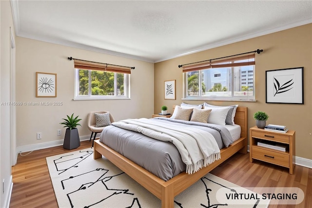 301 NE 14th Ave Unit 201, Hallandale Beach, FL 33009 - bedroom featuring wood finished floors, ornamental molding, and baseboards