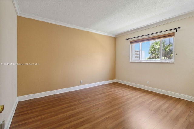 301 NE 14th Ave Unit 201, Hallandale Beach, FL 33009 - unfurnished room with a textured ceiling, wood finished floors, ornamental molding, and baseboards