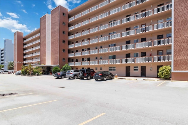 301 NE 14th Ave Unit 201, Hallandale Beach, FL 33009 - view of apartment building / complex featuring uncovered parking