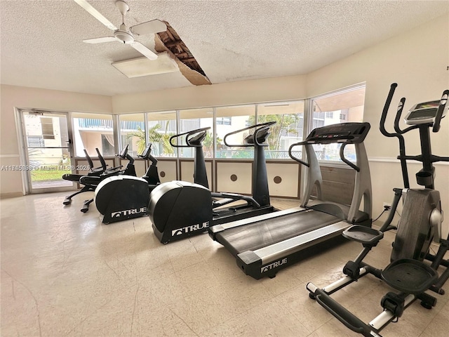 301 NE 14th Ave Unit 201, Hallandale Beach, FL 33009 - exercise room featuring a textured ceiling, healthy amount of natural light, ceiling fan, and tile patterned floors