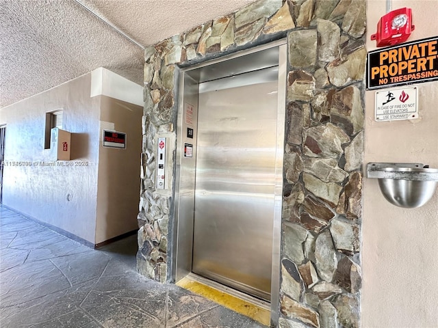 301 NE 14th Ave Unit 201, Hallandale Beach, FL 33009 - elevator with a textured ceiling