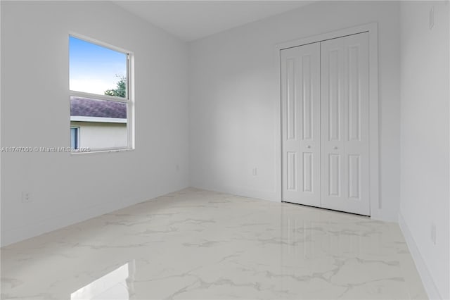 unfurnished bedroom with a closet