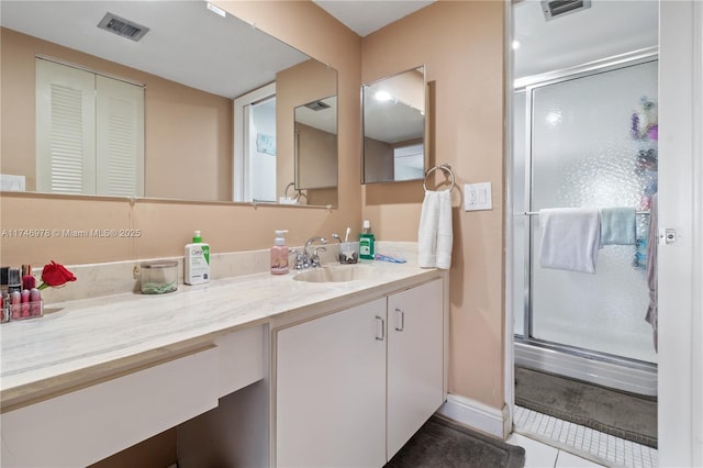 bathroom with vanity and an enclosed shower