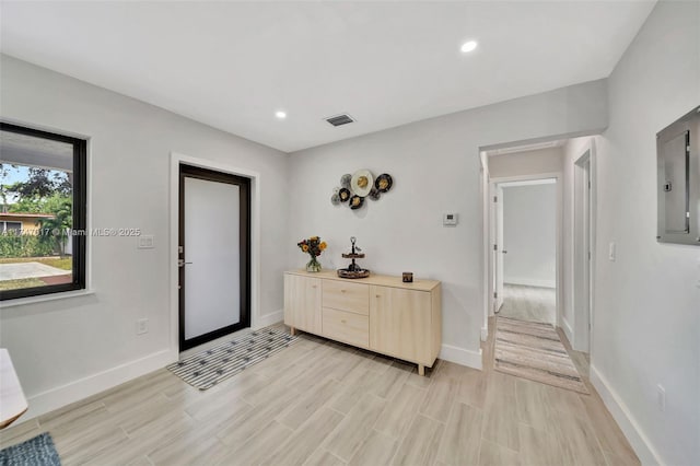 entrance foyer featuring electric panel and light hardwood / wood-style flooring