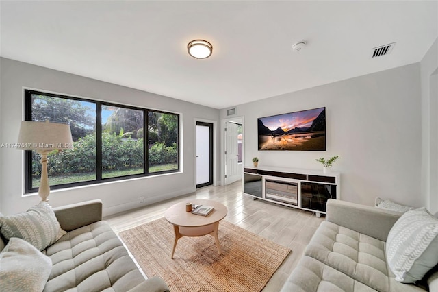 living room featuring light wood-type flooring