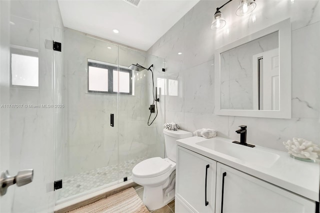 bathroom featuring walk in shower, toilet, tasteful backsplash, tile walls, and vanity