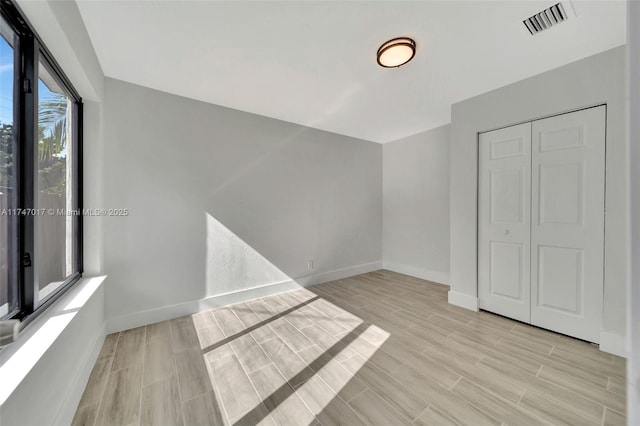 unfurnished bedroom featuring a closet