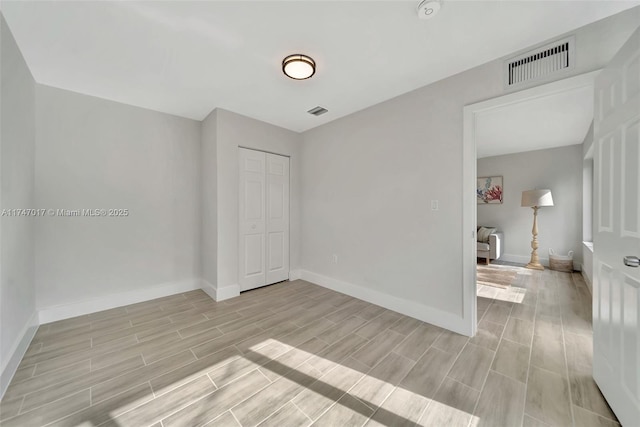 unfurnished bedroom with a closet