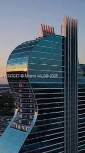 view of outdoor building at dusk