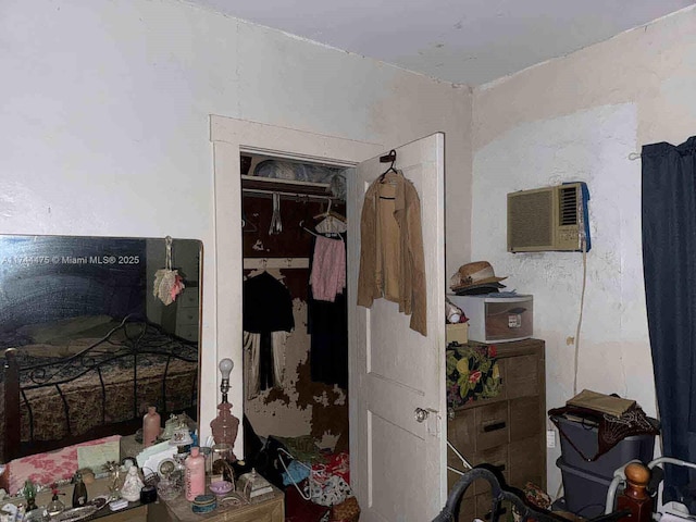 bedroom featuring an AC wall unit