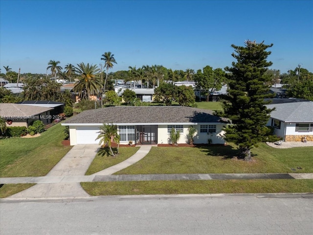 single story home with a front yard and a garage