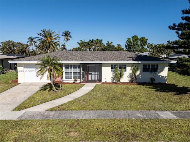 ranch-style home with a front yard and a garage