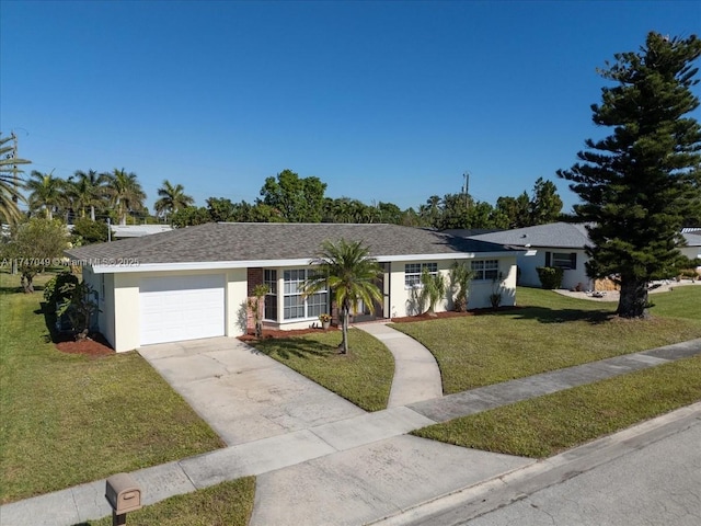 ranch-style house with a garage and a front yard