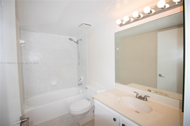 full bathroom with vanity, tiled shower / bath, toilet, and tile patterned floors