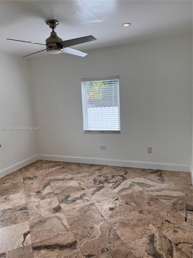 spare room featuring ceiling fan