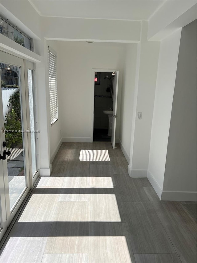 unfurnished room featuring french doors