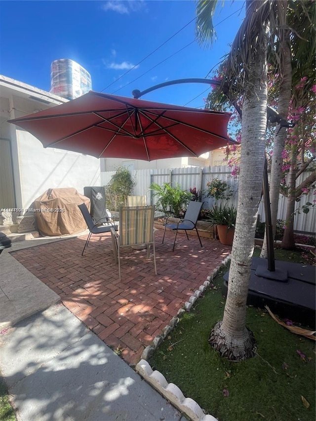 view of patio with a grill