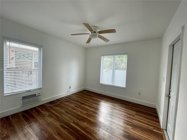 interior space with ceiling fan, dark wood-type flooring, and a wall mounted AC