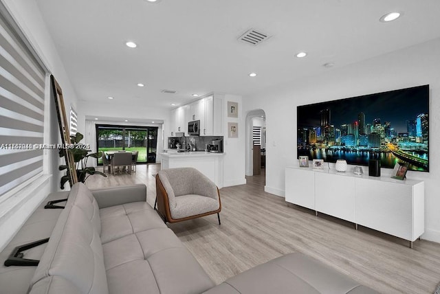 living room with light hardwood / wood-style floors