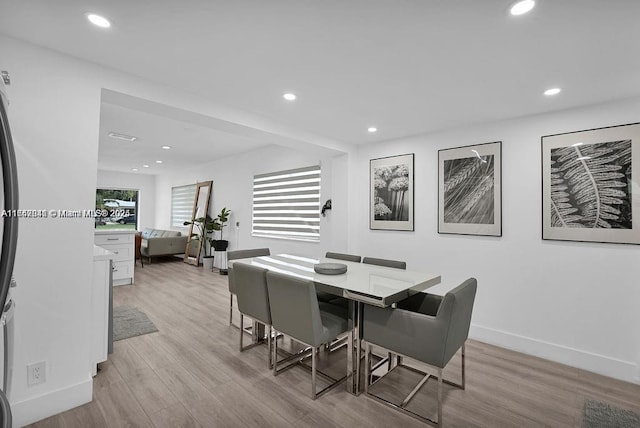 dining room featuring light hardwood / wood-style floors