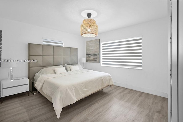 bedroom with light wood-type flooring