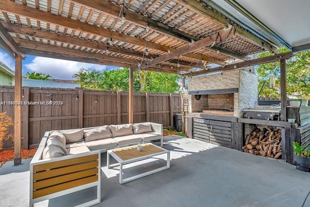 view of patio / terrace with a pergola and an outdoor living space with a fireplace