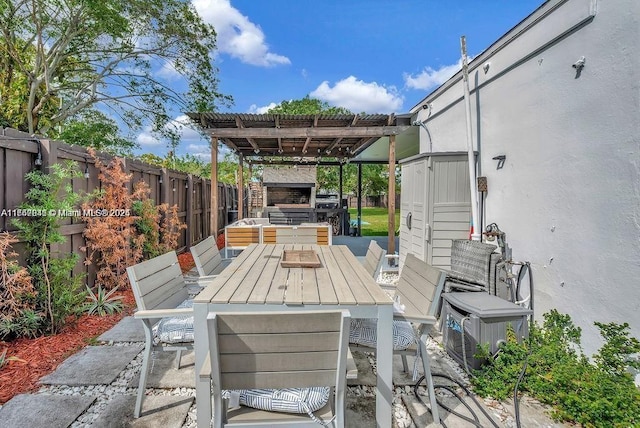 view of patio / terrace featuring an outdoor stone fireplace