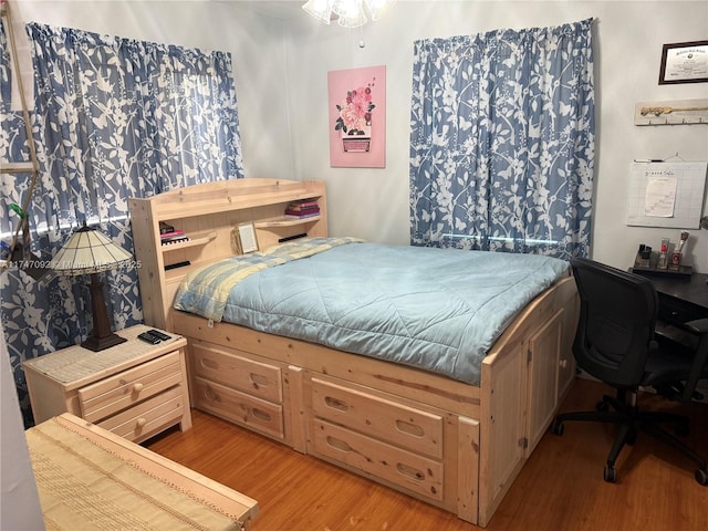 bedroom with light hardwood / wood-style floors