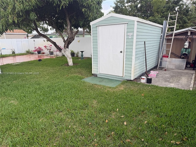 view of outdoor structure with a lawn