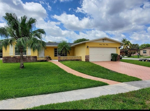 ranch-style house featuring decorative driveway, an attached garage, a front lawn, and stucco siding