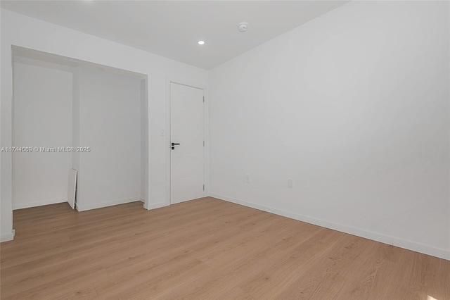 empty room with light wood-type flooring