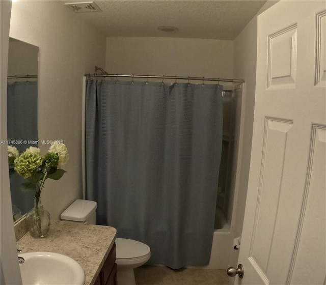 bathroom featuring toilet, vanity, visible vents, tile patterned floors, and shower / bath combination with curtain
